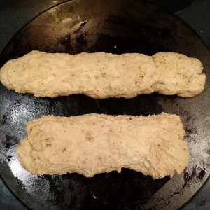 Dough, just shaped into loaves on baking stone.
